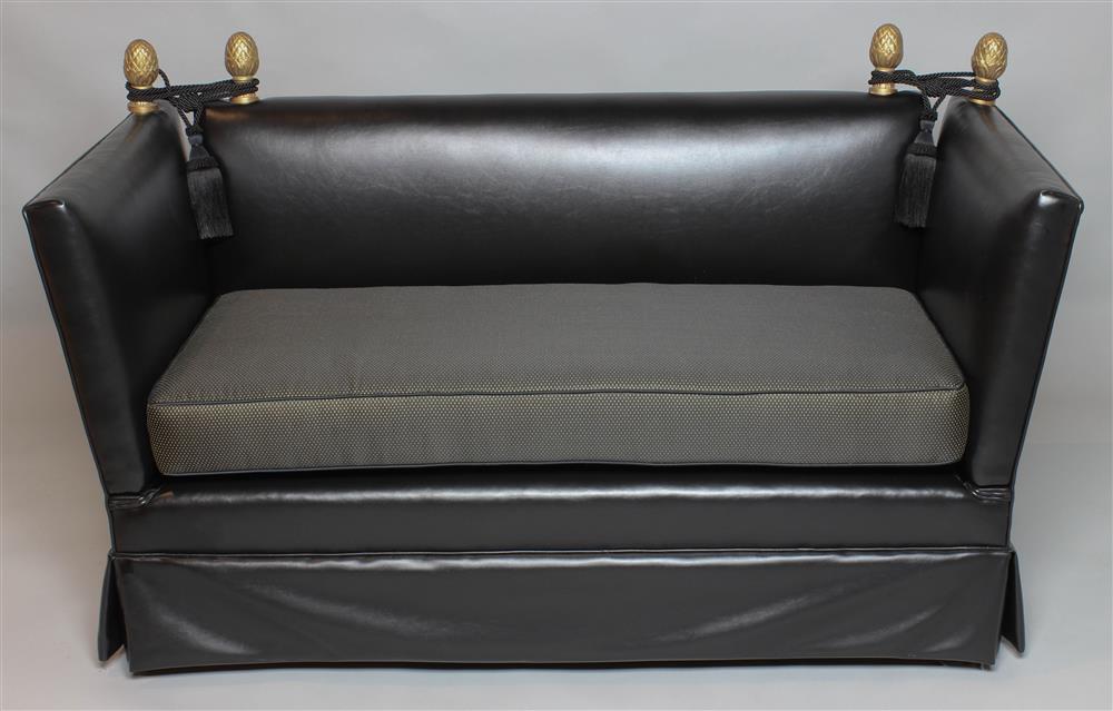 Appraisal: BLACK LEATHER AND PARCEL GILT SETTEE the rectangular padded back