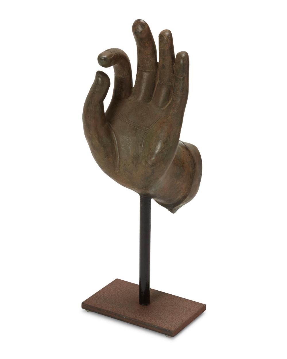 Appraisal: A cast bronze Buddhist-style hand th Century Displaying the gyan