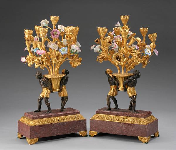 Appraisal: A pair of French gilt patinated bronze and porcelain figural