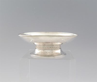 Appraisal: A modern dish with hammered finish on a spreading foot