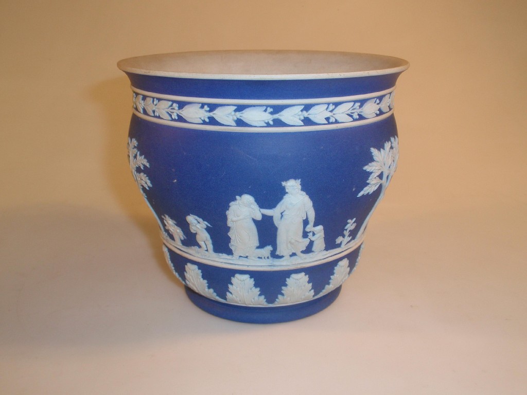 Appraisal: A Wedgwood blue jasper cachepot of ogee form sprigged with