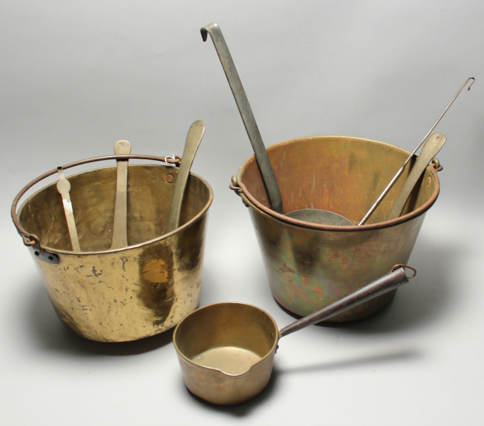 Appraisal: TWO BRASS HANDLED BUCKETS th CenturyTogether with six mostly brass