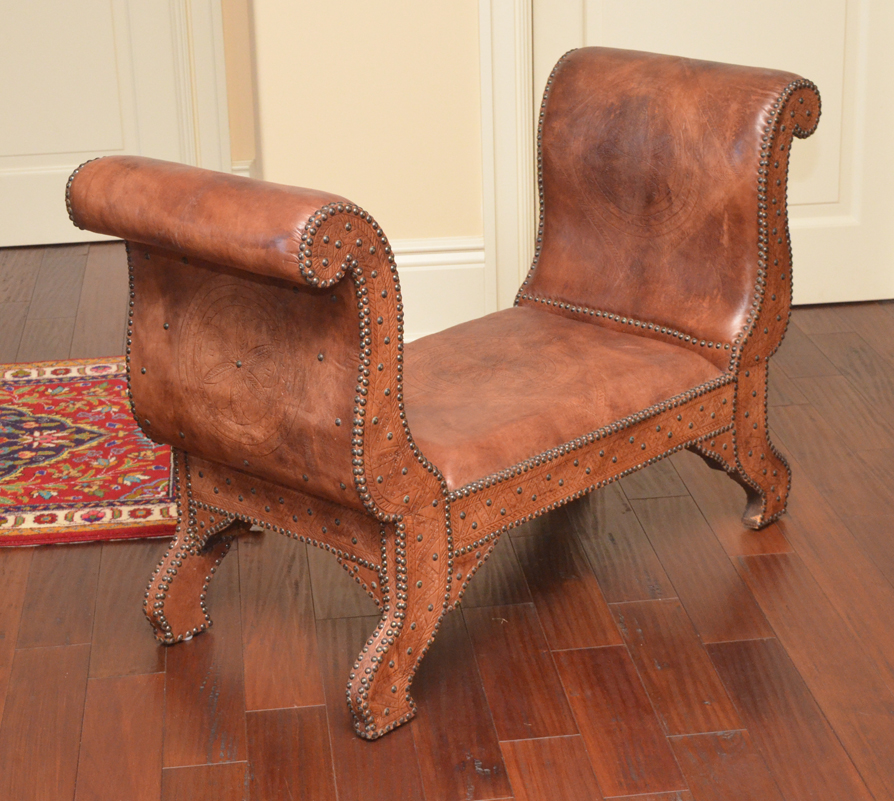 Appraisal: PAIR DIMINUTIVE TOOLED LEATHER BANQUETTE BENCHES Tooled and tacked leather