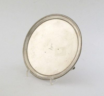 Appraisal: A George III circular waiter with a double border of