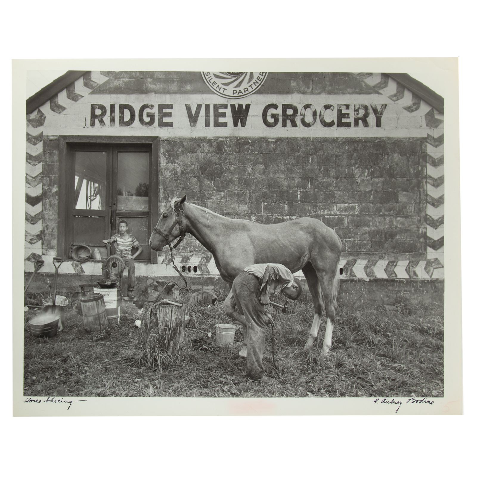 Appraisal: A AUBREY BODINE HORSE SHOEING PHOTOGRAPH American - Gelatin silver