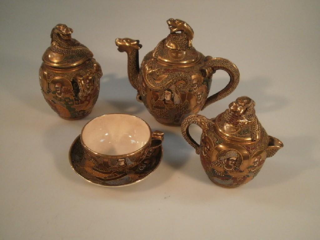 Appraisal: A boxed thC Japanese Satsuma export tea service including teapot