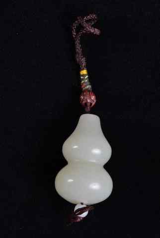 Appraisal: Chinese Carved Jade Double Gourd PendantCarved and finely polished light