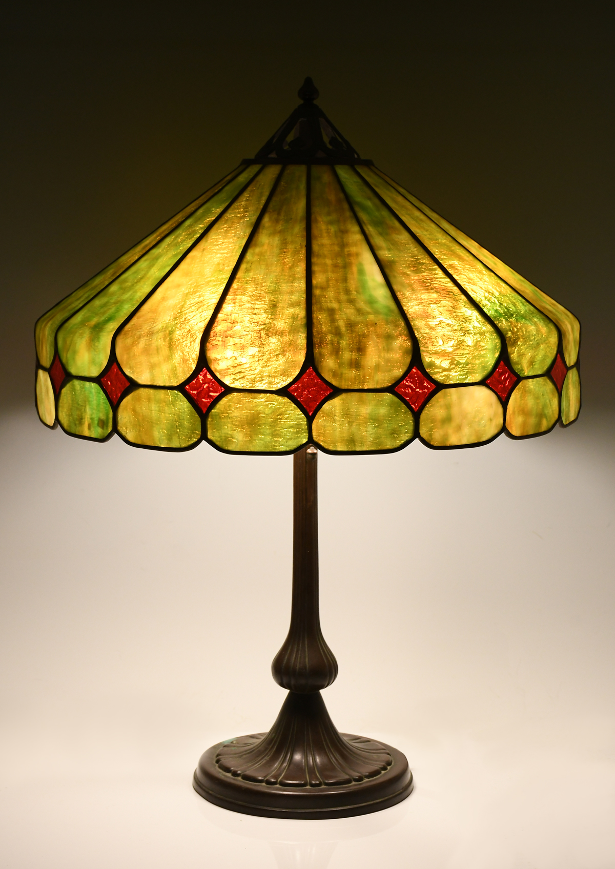 Appraisal: HANDEL BRONZE LEADED GLASS TABLE LAMP - Light Bronze base