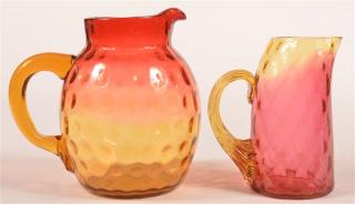 Appraisal: Amberina Blown Victorian Art Glass Pitchers Two Amberina Blown Victorian