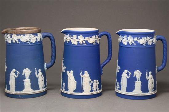 Appraisal: Three Wedgwood blue and white jasperware jugs late th early