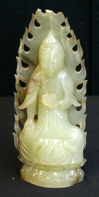 Appraisal: A jade figure of a seated Buddha first half of