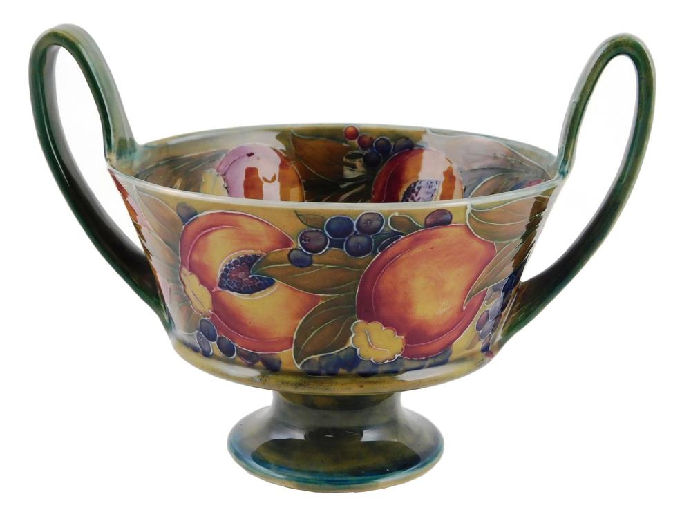 Appraisal: Moorecroft Pomengrante Berry footed bowl with double open handles c