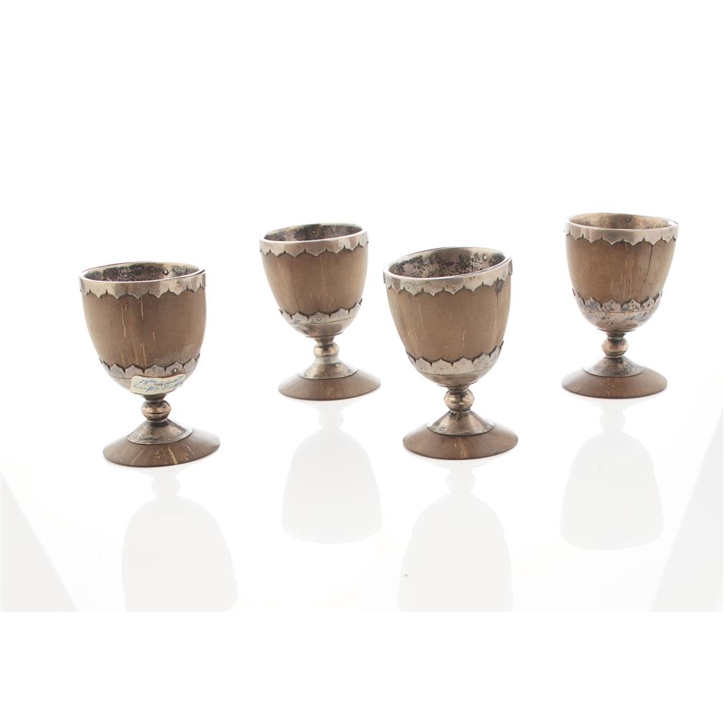 Appraisal: A set of four silver mounted nut egg cups unmarked