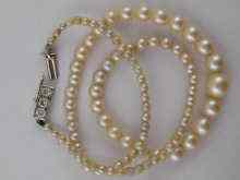 Appraisal: A cultured pearl necklace with diamond clasp set in white