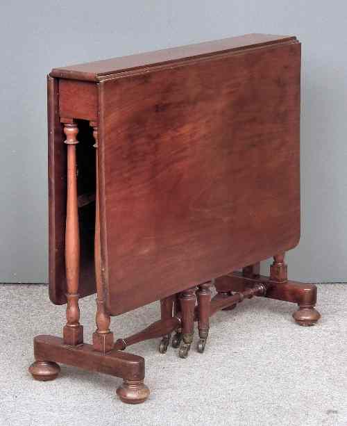 Appraisal: A Victorian mahogany rectangular Sutherland table with plain top on