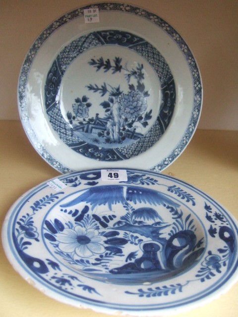 Appraisal: A Delft plate th century decorated with stylized flowers and