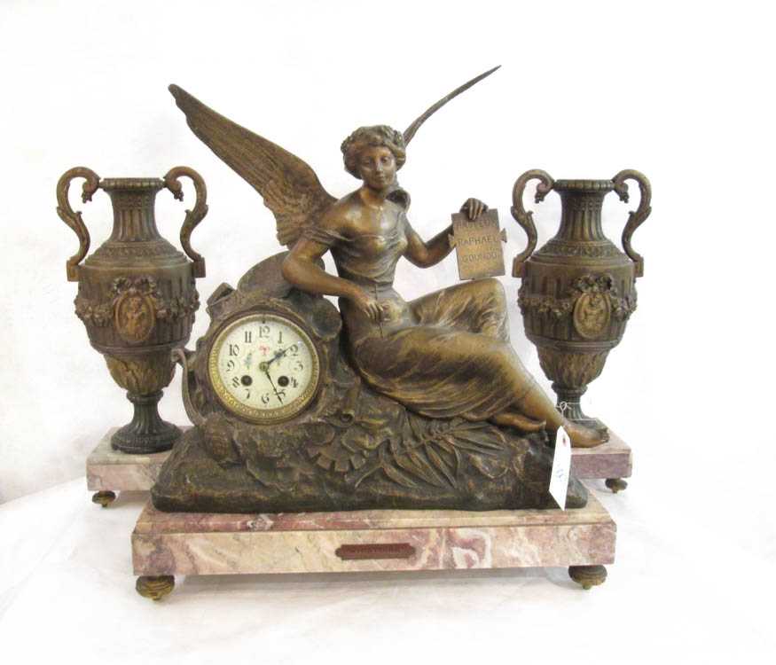 Appraisal: THREE-PIECE FIGURAL MANTEL CLOCK SET French late th century the