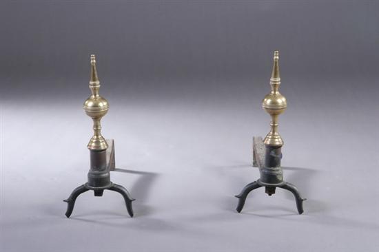 Appraisal: PAIR BRASS AND WROUGHT IRON ANDIRONS th century Steiple finials