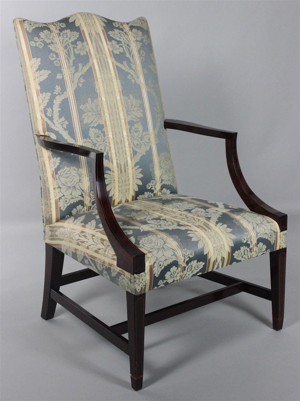 Appraisal: FEDERAL STYLE INLAID MAHOGANY LOLLING CHAIR the serpentine padded back