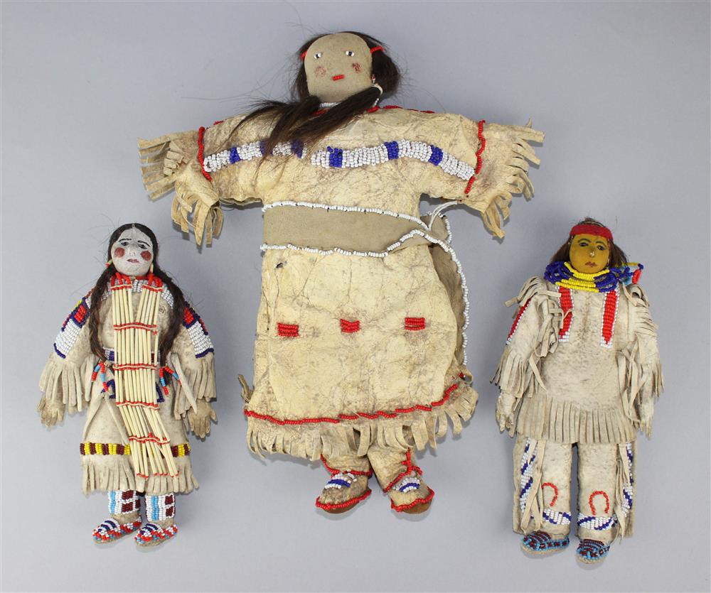 Appraisal: THREE PLAINS BEADED AND FRINGED HIDE DOLLS Reservation period male