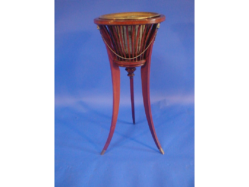 Appraisal: An Edwardian string inlaid mahogany jardiniere stand with brass insert