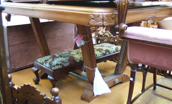 Appraisal: A th century oak framed dining table raised on carved