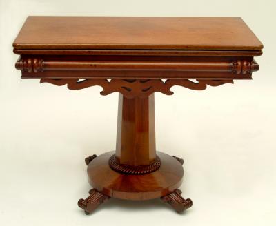 Appraisal: A VICTORIAN FOLDING TEA TABLE of rounded oblong form with