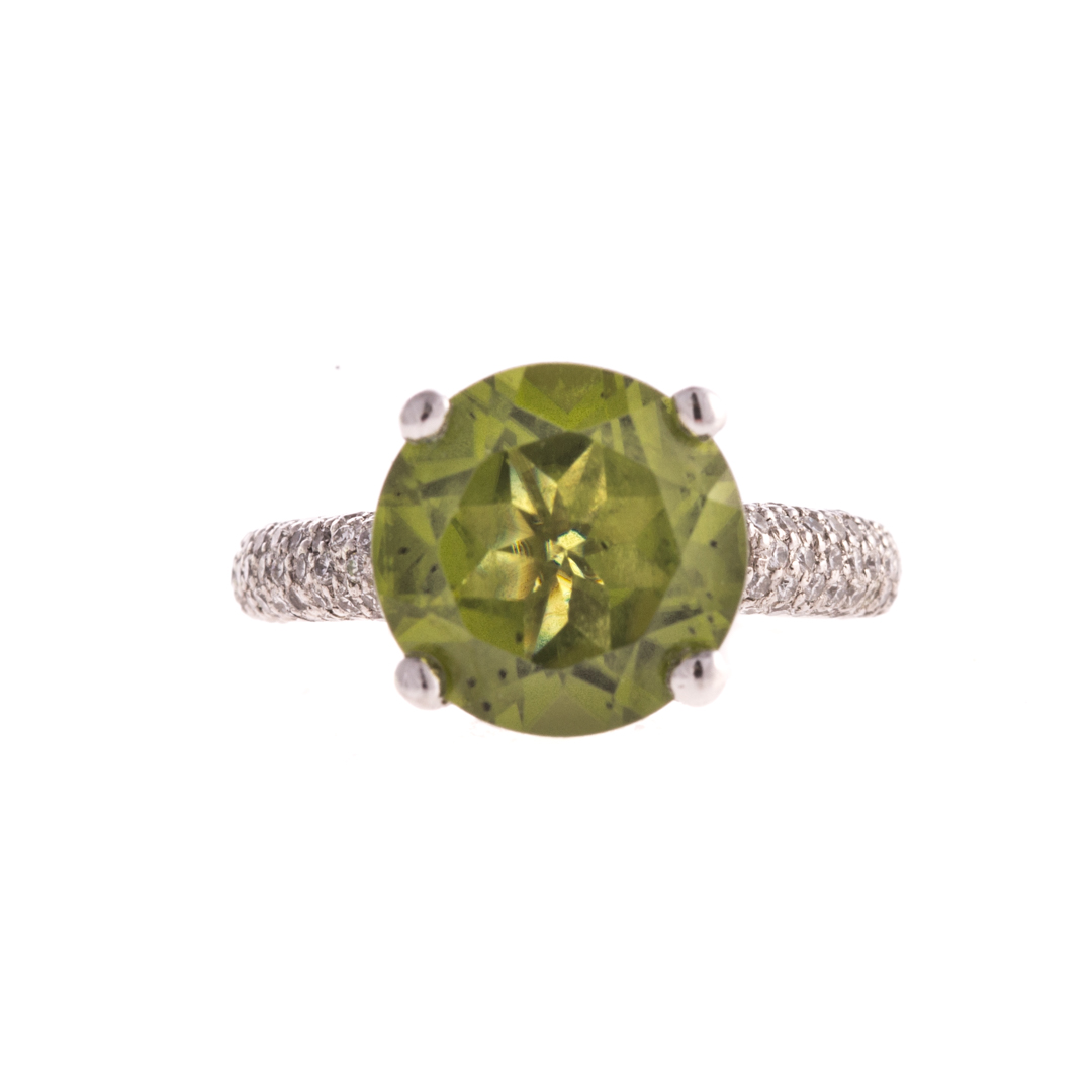 Appraisal: A Ladies Platinum Peridot and Diamond Ring Platinum ring with