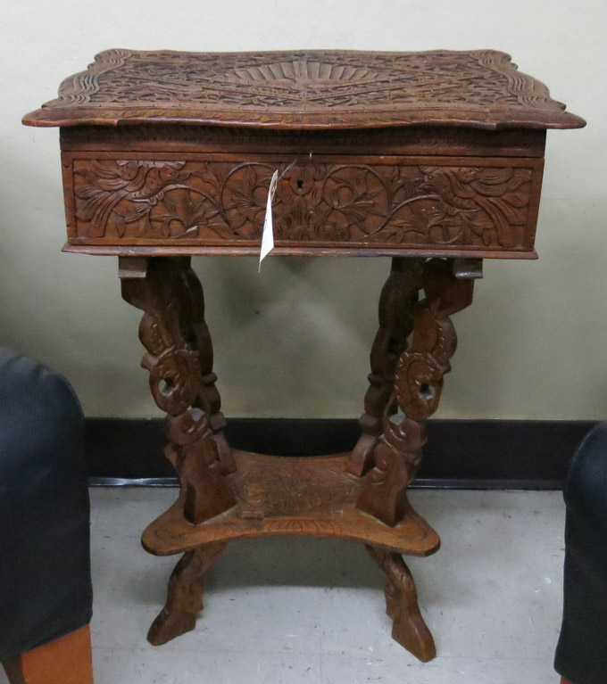 Appraisal: HIGHLY CARVED LIFT-TOP SEWING TABLE Continental th century H x