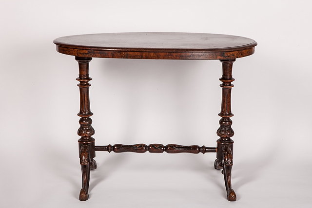 Appraisal: A VICTORIAN WALNUT OVAL OCCASIONAL TABLE with a plain top