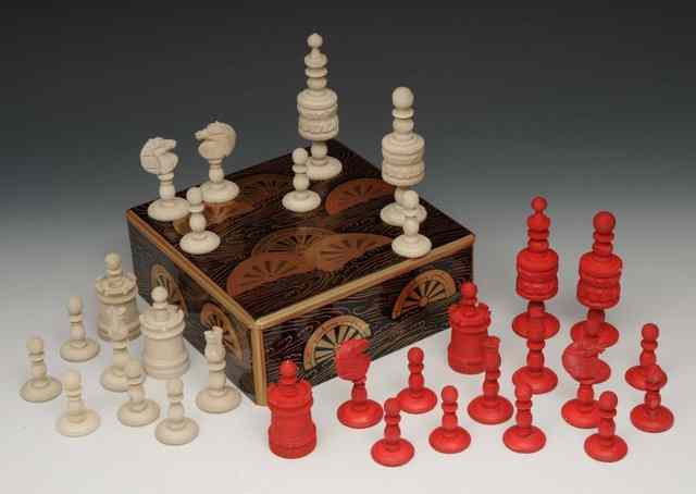 Appraisal: A CHINESE CARVED AND STAINED BONE CHESS SET th Century