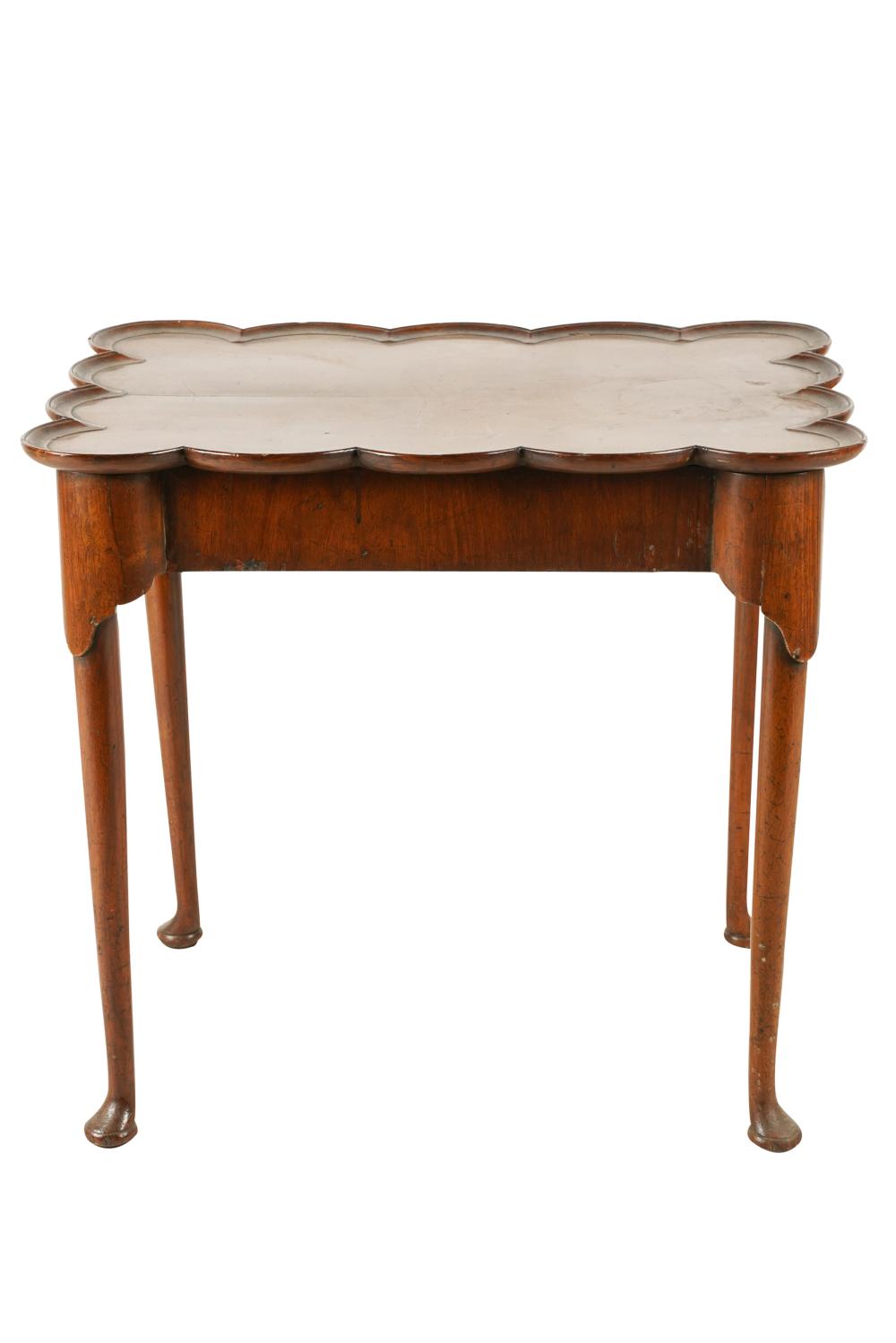 Appraisal: ANTIQUE QUEEN ANNE-STYLE WALNUT SIDE TABLEthe scalloped rectangular top over