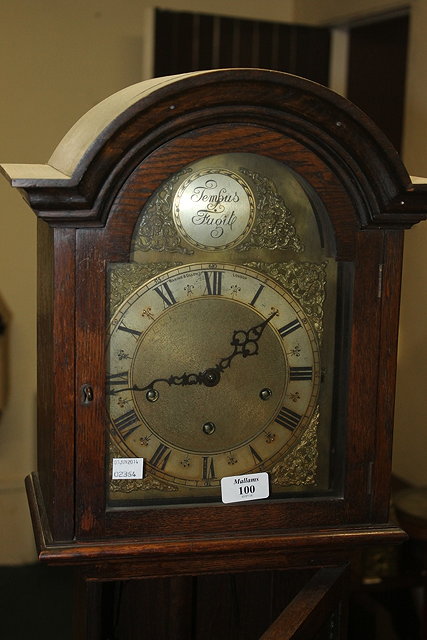 Appraisal: AN OAK GRANDMOTHER CLOCK with brass and silvered dial retailed