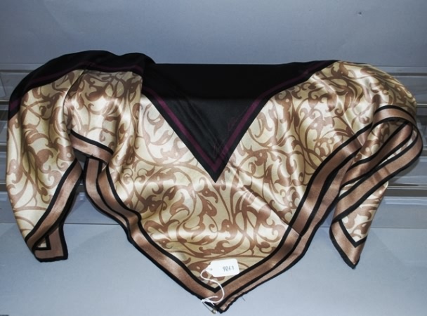 Appraisal: Ann Klein black tan cream purple print silk scarf Approx