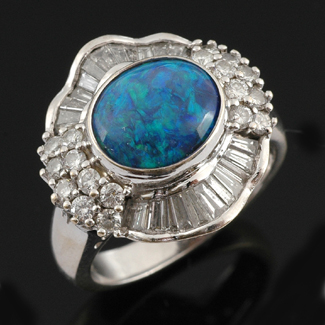 Appraisal: A solid black opal and diamond cluster ring The oval