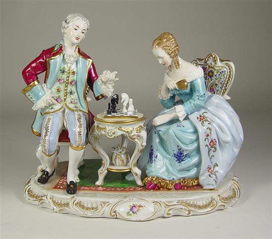 Appraisal: Dresden Figural Group Gentleman and lady playing chess Lady in