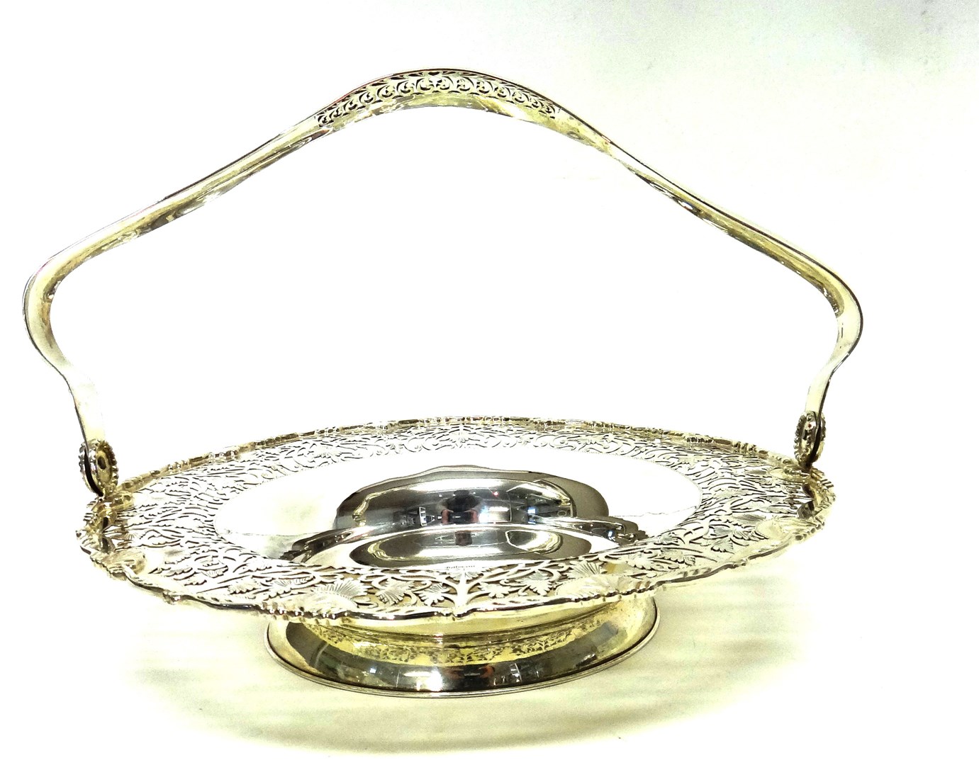 Appraisal: A modern silver cake or fruit basket of shaped circular