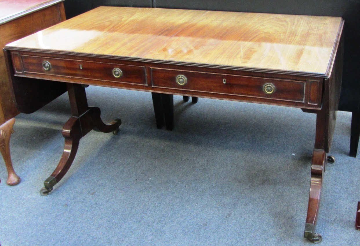 Appraisal: A Regency mahogany two drawer sofa table on trestle end