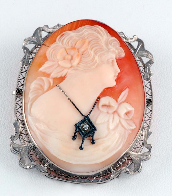 Appraisal: Carved cameo pendant brooch in marked K white gold filigree