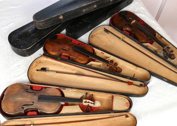 Appraisal: THREE ANTIQUE VIOLINS SIX WOOD VIOLIN CASESThe collection offered here