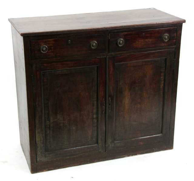 Appraisal: An early th Century mahogany cupboard with two drawers above