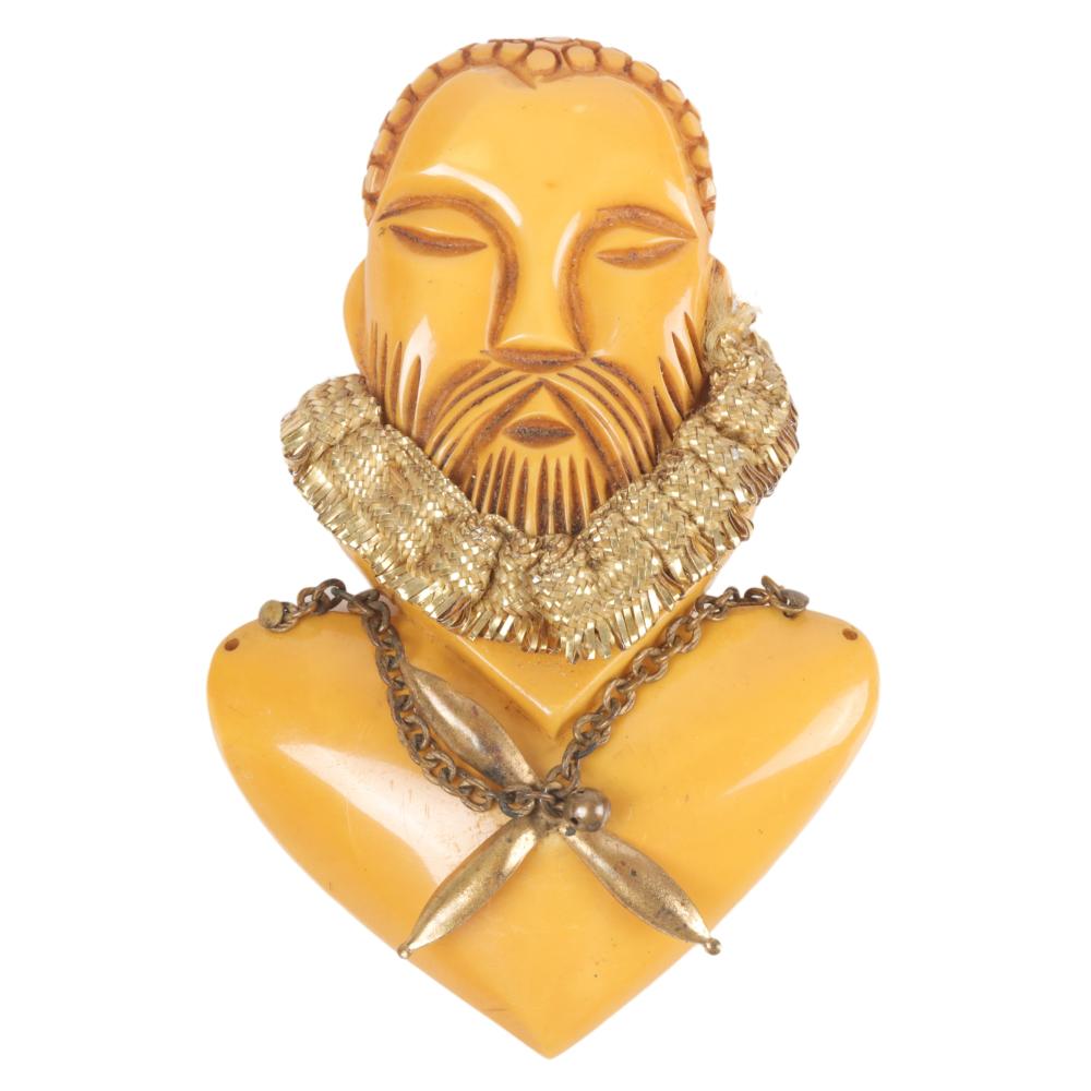 Appraisal: BUTTERSCOTCH BAKELITE WILLIAM SHAKESPEARE PIN WITH GOLD RUFFLES H X