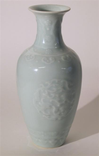 Appraisal: Chinese molded and celadon glazed porcelain vaseqianlong mark early th