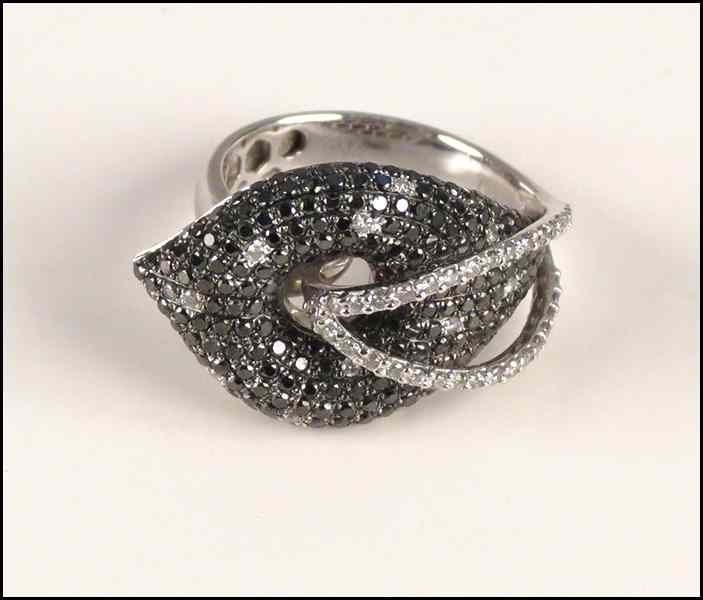 Appraisal: BLACK AND WHITE DIAMOND AND KARAT WHITE GOLD RING Diamonds