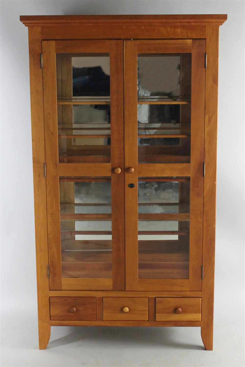 Appraisal: BORKHOLDER CHERRY CURIO CABINET WITH GLASS SHELVES EN SUITE flared