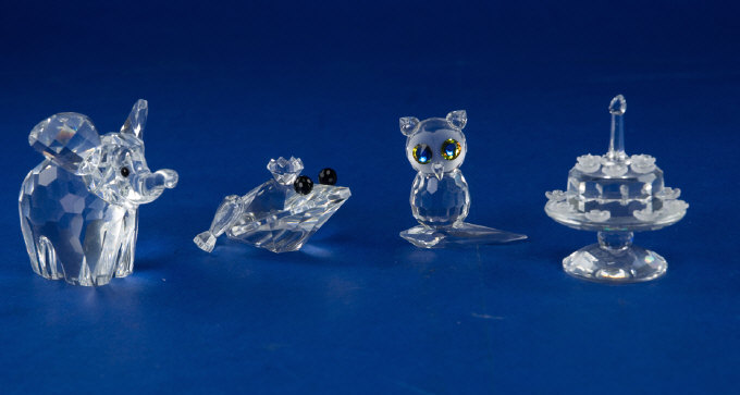 Appraisal: Collection Of Swarovski Items Comprising Frog Prince Small Elephant -