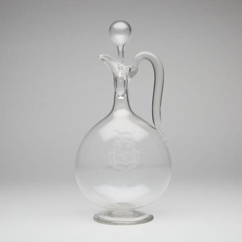 Appraisal: English Engraved Glass Armorial Claret Jug late th century with