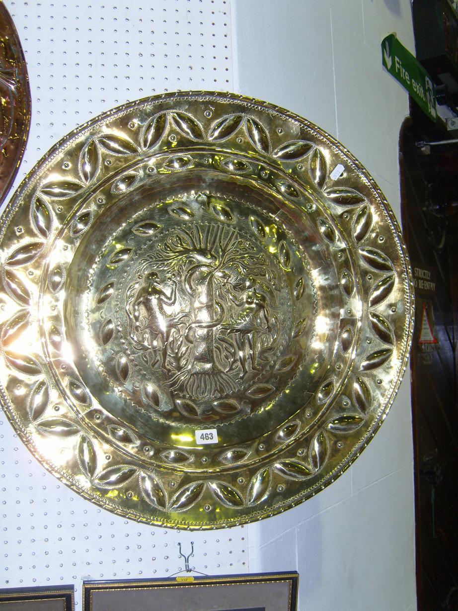 Appraisal: A th century embossed brass alms dish the centre panel