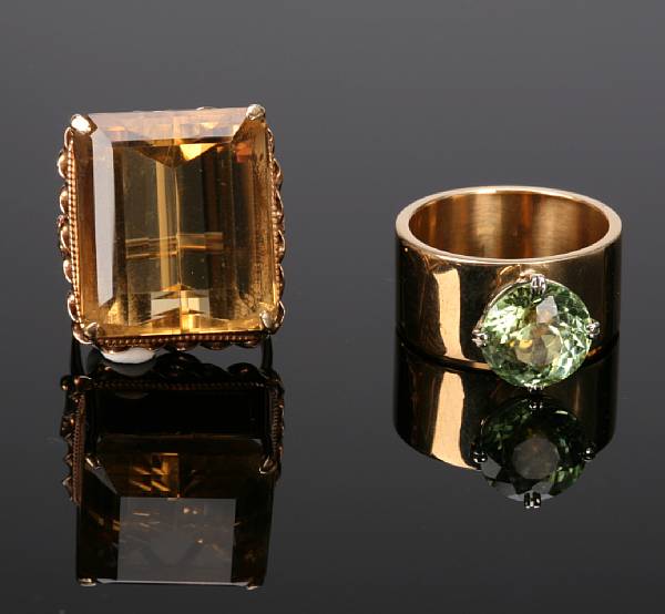 Appraisal: A peridot and gold ring with citrine and gold ring