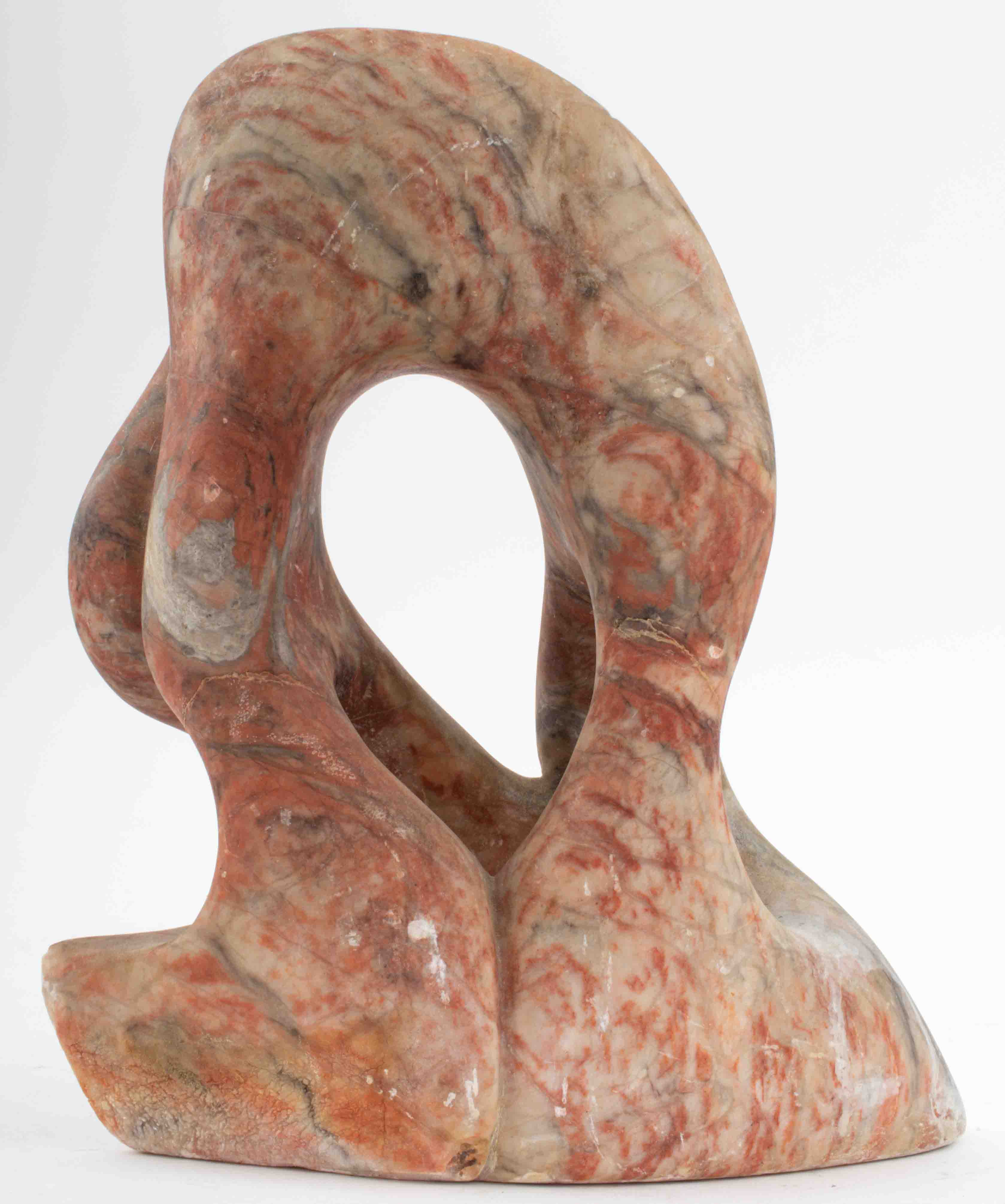 Appraisal: MARBLED RED STONE CARVED ABSTRACT SCULPTURE Stone carving of freeform